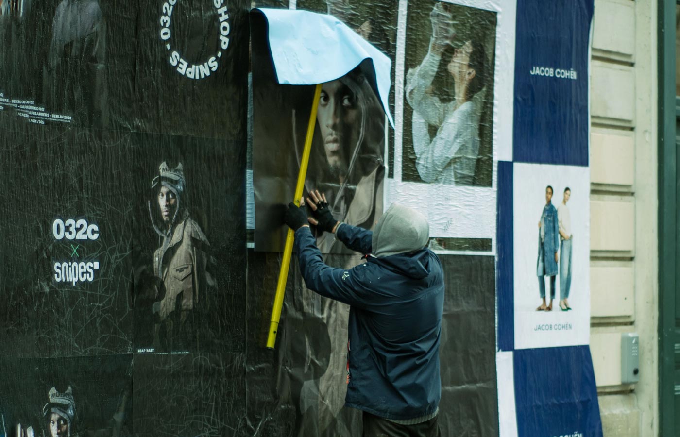 Wheatpaste poster installation by street teams in Nashville